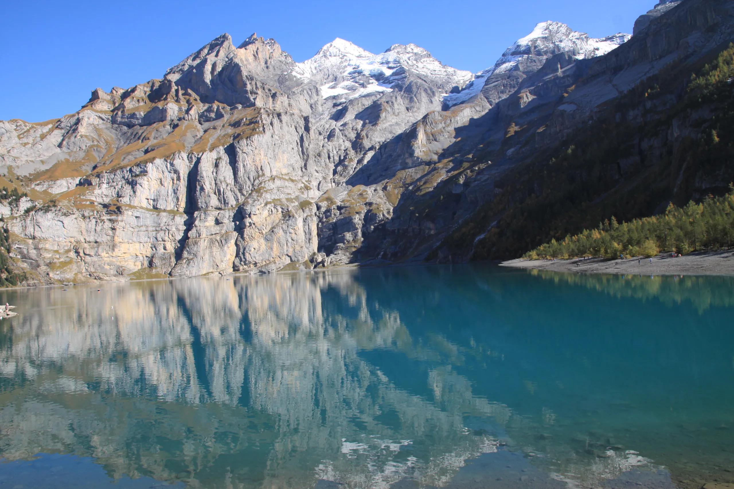 Mountains mirrored in the still water of Oeschinensee, Bernese Oberland